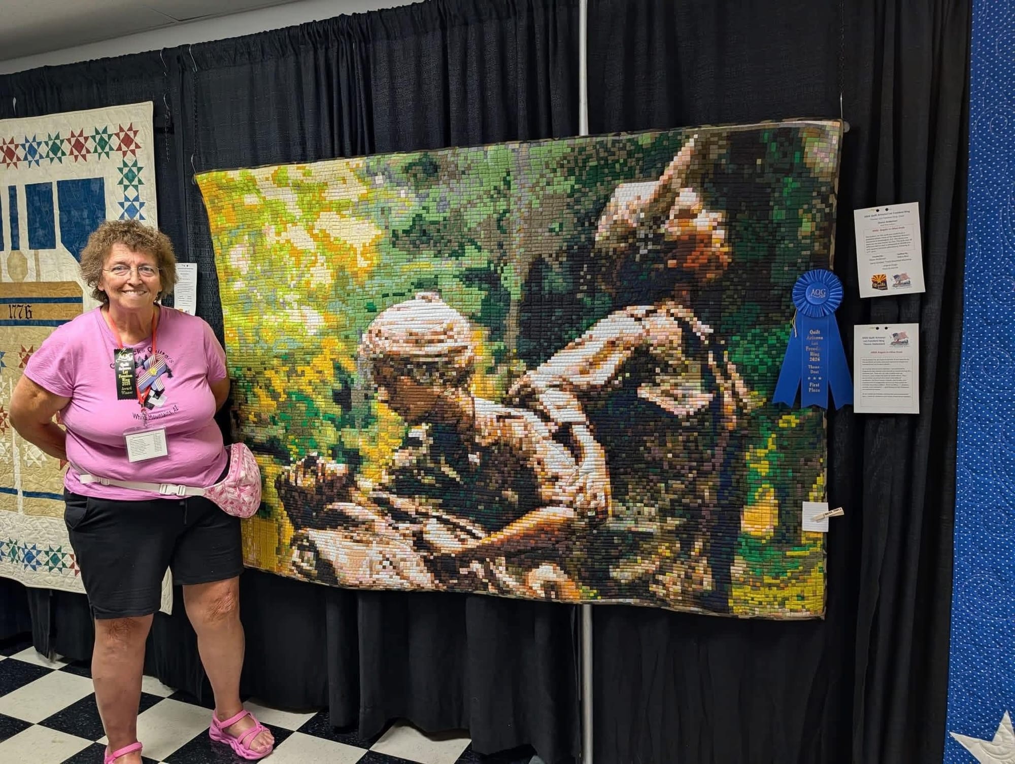 the quilt is an image of the Vietnam Womens Memorial in Washington, DC. 